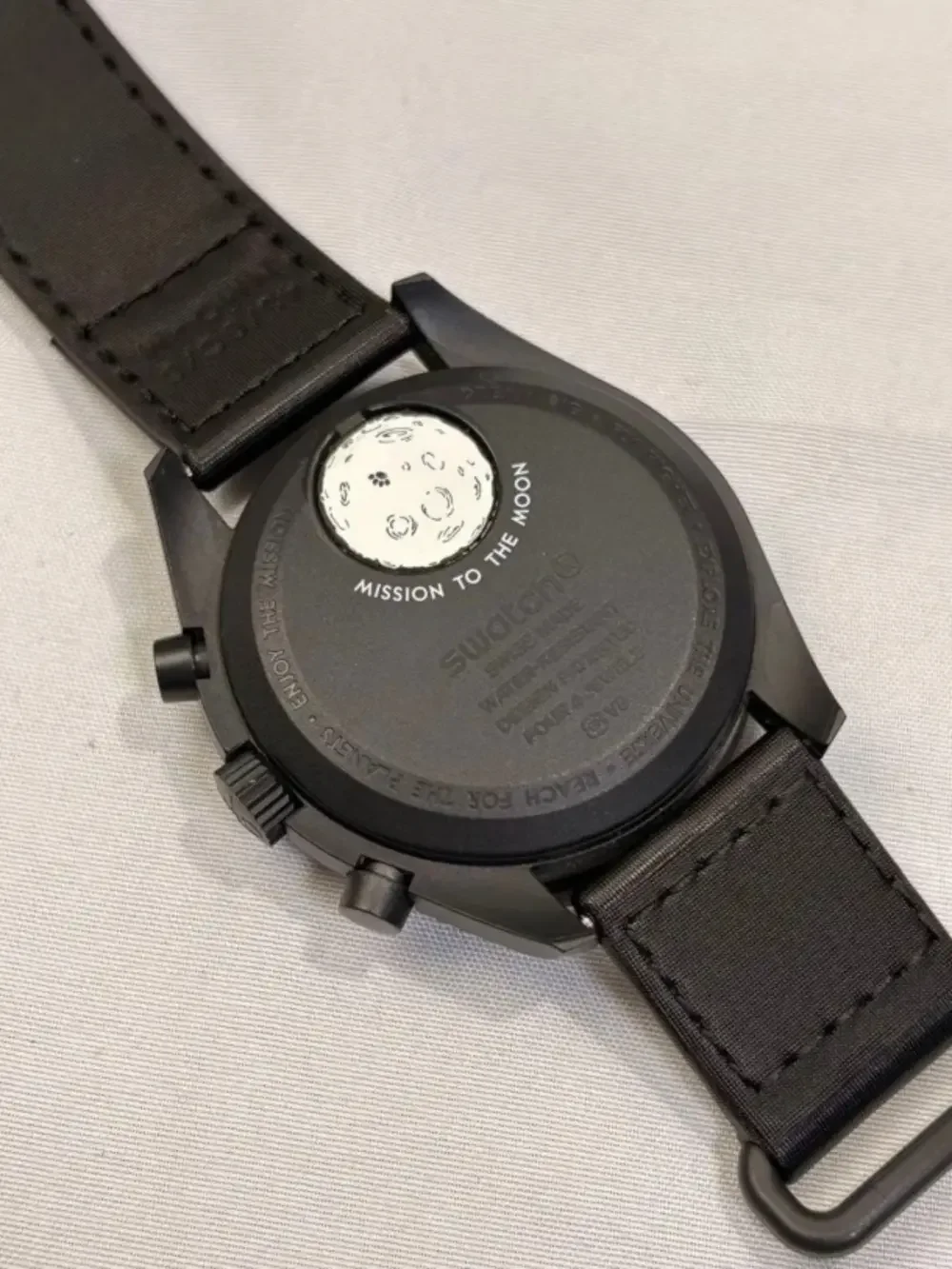 OMEGA x Swatch MISSION TO THE MOONPHASE NEW MOON Black Bioceramic Snoopy Watch.